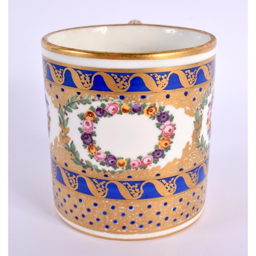 149 - Sevres large coffee can painted with wreaths of flowers and ornately gilded on a cobalt blue ground ... 