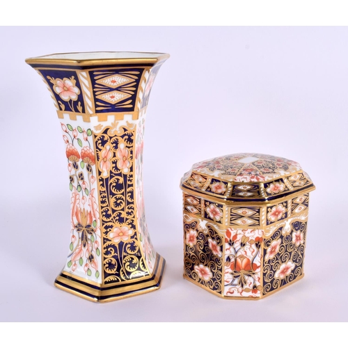 164 - Royal Crown Derby box and cover and a Royal Crown Derby hexagonal vase.  Box 9cm high, vase 16.5 cm ... 