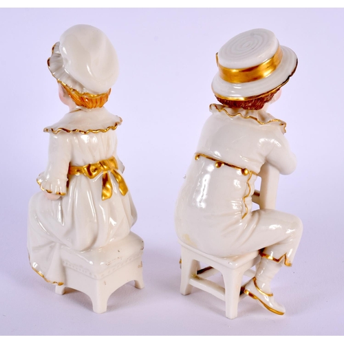 218 - 19th century Royal Worcester pair of figures of two children seated on a chair, decorated with colou... 