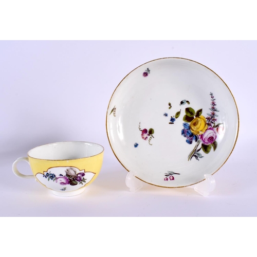 259 - 18th century Meissen yellow ground teacup and saucer painted with flower, the teacup with shaped pan... 