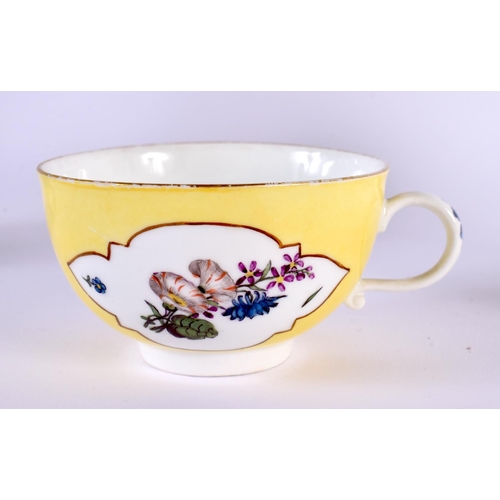 259 - 18th century Meissen yellow ground teacup and saucer painted with flower, the teacup with shaped pan... 