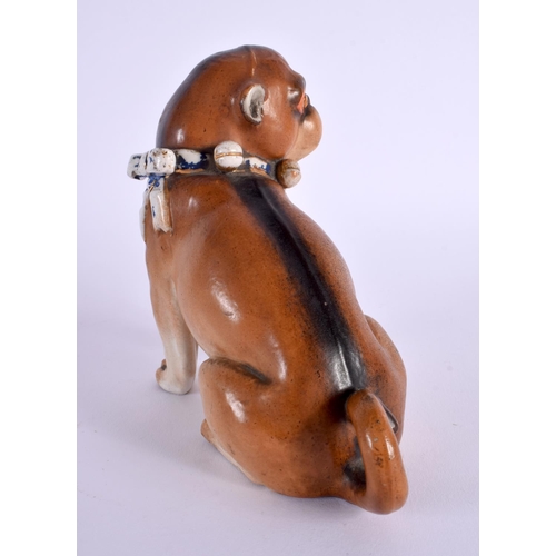 28 - A 19TH CENTURY GERMAN PORCELAIN FIGURE OF A SEATED DOG. 14 cm x 12 cm.