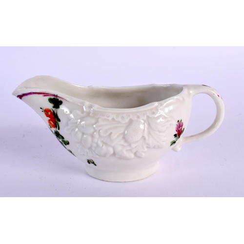 283 - 18th century Plymouth butterboat moulded with fruit and painted with a chain of flowers.  5cm high