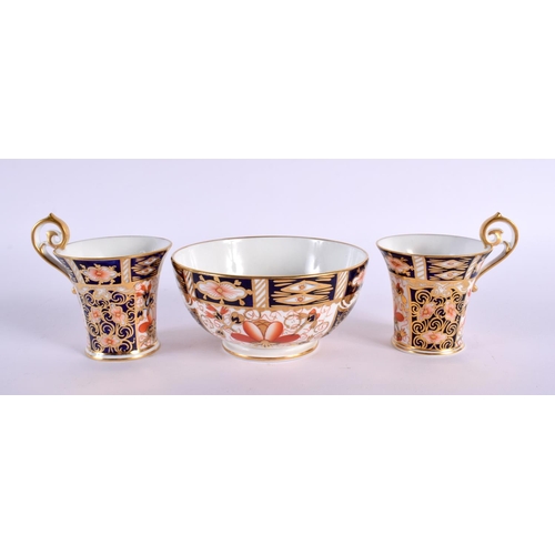 294 - Royal Crown Derby pair of unusually shaped demi-tasse coffee cup and saucer together with a similar ... 