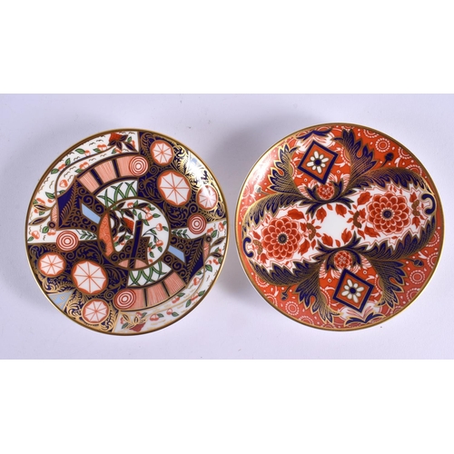 297 - Royal Crown Derby: two imari pattern coffee cans and saucers together with seven floral dishers.  Cu... 