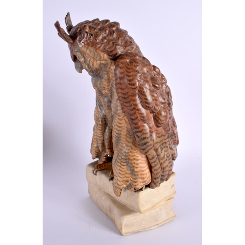 30 - A LARGE 19TH CENTURY CONTINENTAL PORCELAIN FIGURE OF AN OWL modelled seated upon books. 25 cm x 11 c... 