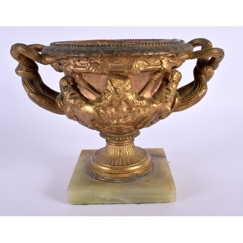 308 - A 19TH CENTURY EUROPEAN GRAND TOUR GILT BRONZE WARWICK VASE decorated with mask heads. 18 cm x 15 cm... 