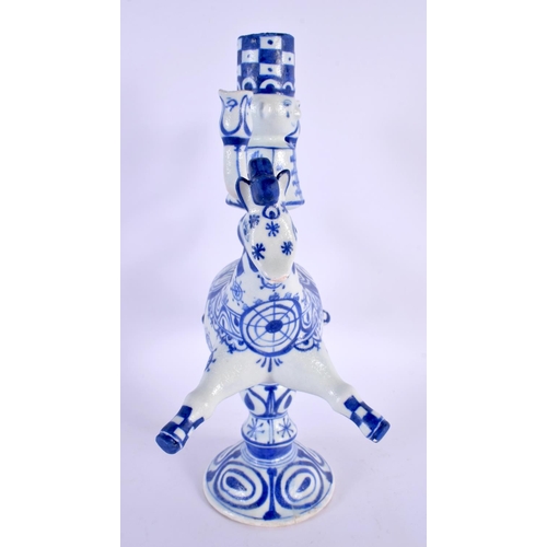 317 - A DANISH BLUE AND WHITE FIGURAL CANDLESTICK. 32 cm x 18 cm.