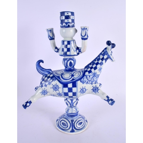 317 - A DANISH BLUE AND WHITE FIGURAL CANDLESTICK. 32 cm x 18 cm.