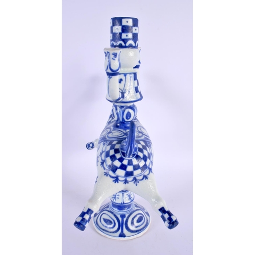 317 - A DANISH BLUE AND WHITE FIGURAL CANDLESTICK. 32 cm x 18 cm.