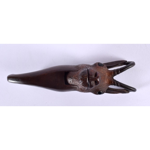 323 - A PAIR OF ANTIQUE BAVARIAN BLACK FOREST CARVED WOOD NUT CRACKERS formed as a deer. 15 cm long.