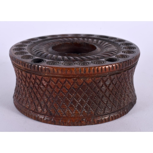 324 - AN ANTIQUE CONTINENTAL TREEN FRUITWOOD INCENSE BURNER decorated with roundels. 9.5 cm diameter.