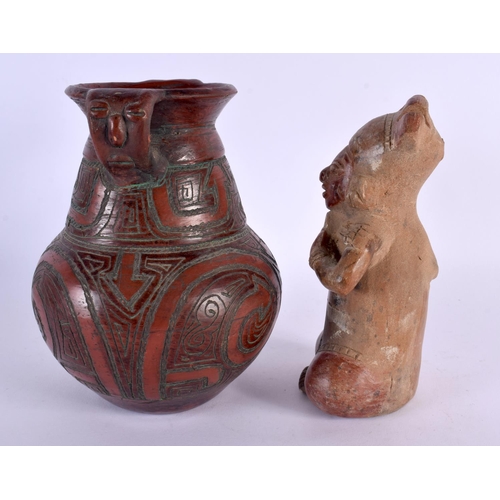 325 - A SOUTH AMERICAN POTTERY FIGURE OF A SEATED GOD together with a similar twin handled vase. Largest 1... 