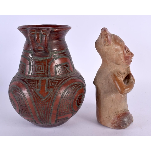 325 - A SOUTH AMERICAN POTTERY FIGURE OF A SEATED GOD together with a similar twin handled vase. Largest 1... 