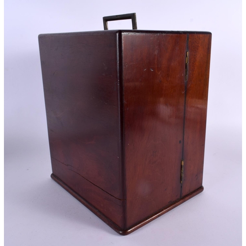 328 - AN EARLY VICTORIAN MAHOGANY APOTHECARY SET with partial contents. 24 cm x 18 cm closed.