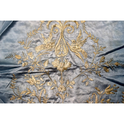 332 - A MIDDLE EASTERN TURKISH SILK BLUE TEXTILE decorated with flowers. 95 cm square.