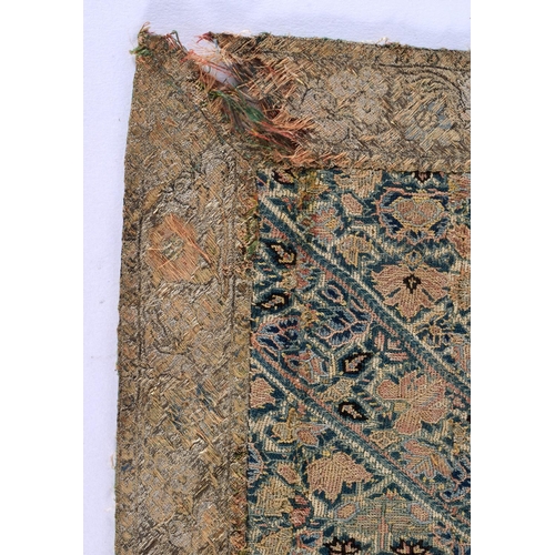 342 - AN ANTIQUE CONTINENTAL EMBROIDERED SILK TEXTILE depicting angular panels foliage. 75 cm x 55 cm.