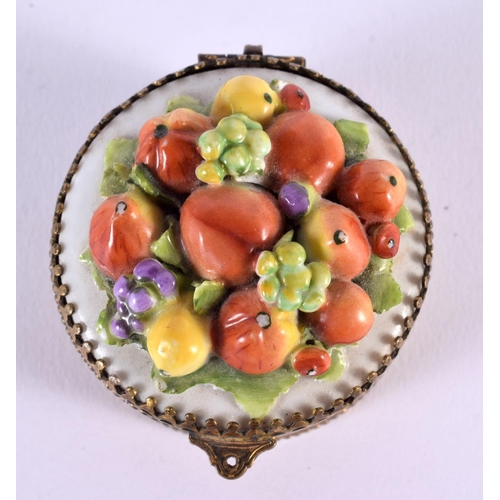 349 - A CONTINENTAL PORCELAIN GILT METAL FRUIT PILL BOX. 7 cm wide.