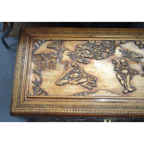 363 - A LARGE 19TH CENTURY CHINESE CARVED HARDWOOD COFFER Qing, carved with figures in landscapes. 90 cm x... 