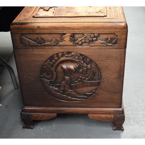 363 - A LARGE 19TH CENTURY CHINESE CARVED HARDWOOD COFFER Qing, carved with figures in landscapes. 90 cm x... 