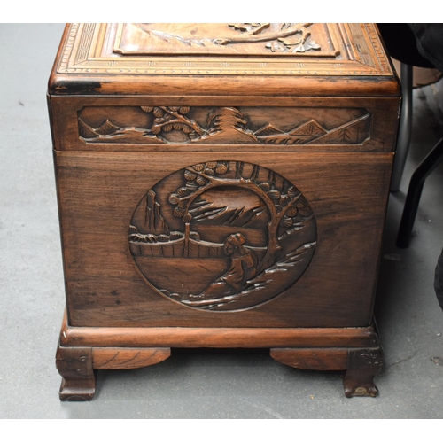 363 - A LARGE 19TH CENTURY CHINESE CARVED HARDWOOD COFFER Qing, carved with figures in landscapes. 90 cm x... 