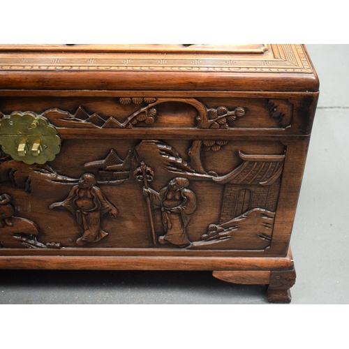 363 - A LARGE 19TH CENTURY CHINESE CARVED HARDWOOD COFFER Qing, carved with figures in landscapes. 90 cm x... 