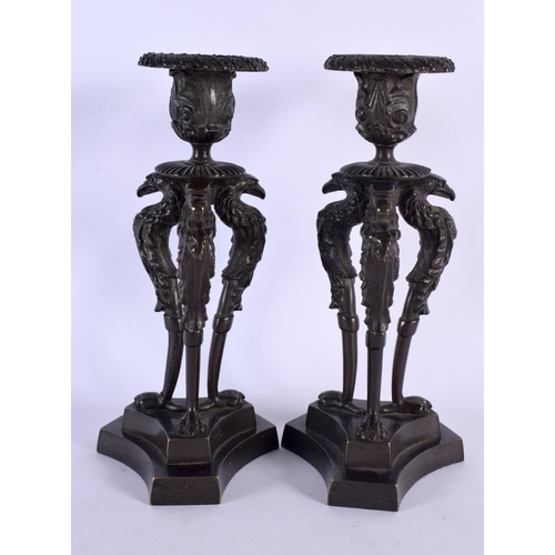 378 - A PAIR OF 19TH CENTURY EUROPEAN BRONZE CANDLESTICKS formed with bird heads. 21 cm high.