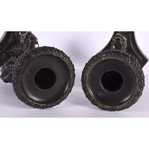 378 - A PAIR OF 19TH CENTURY EUROPEAN BRONZE CANDLESTICKS formed with bird heads. 21 cm high.