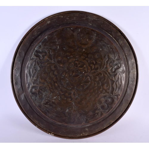 381 - A 19TH CENTURY CONTINENTAL BRASS PUNCH WORK CHARGER decorated with foliage. 42 cm diameter.