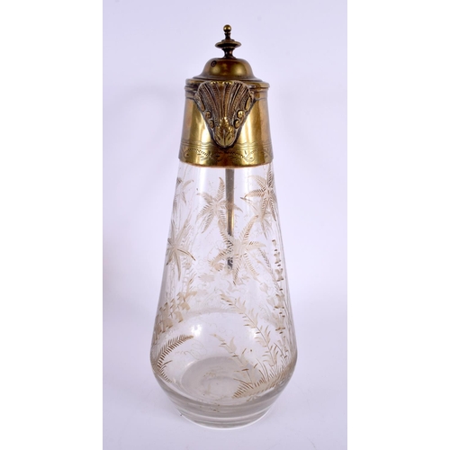 39 - A LARGE ANTIQUE AESTHETIC MOVEMENT GLASS CLARET JUG decorated with landscapes. 27 cm x 12 cm.