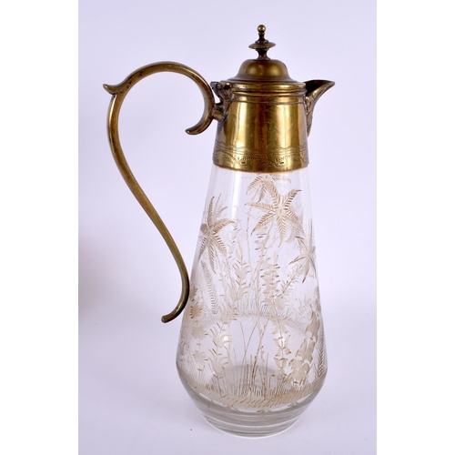 39 - A LARGE ANTIQUE AESTHETIC MOVEMENT GLASS CLARET JUG decorated with landscapes. 27 cm x 12 cm.