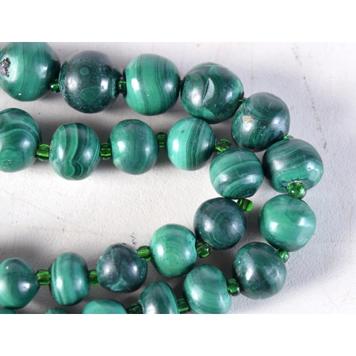 1010 - A MALACHITE NECKLACE. 108 grams. 54 cm long.