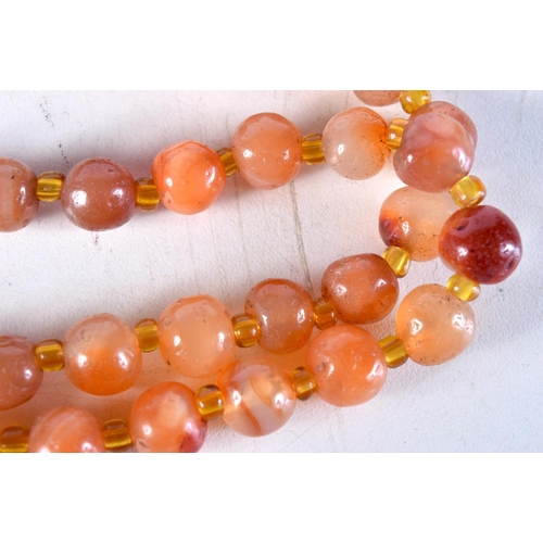 1014 - A LONG AGATE NECKLACE. 134 grams. 120 cm long.