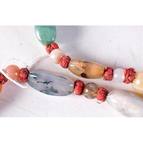 1015 - A LONG AGATE NECKLACE. 106 grams. 93 cm long.