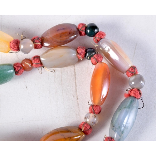 1015 - A LONG AGATE NECKLACE. 106 grams. 93 cm long.