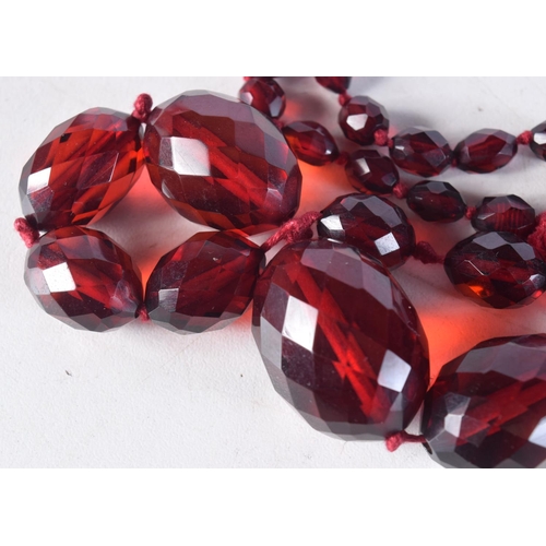 1016 - A CHERRY AMBER TYPE NECKLACE. 61 grams. 96 cm long.