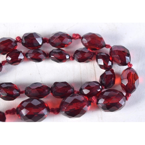 1016 - A CHERRY AMBER TYPE NECKLACE. 61 grams. 96 cm long.