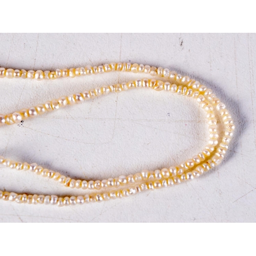 1017 - A 9CT GOLD AND PEARL NECKLACE. 2.7 grams. 35 cm long.