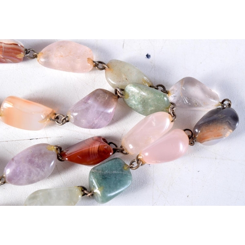 1038 - A LONG AGATE NECKLACE. 112 grams. 92 cm long.