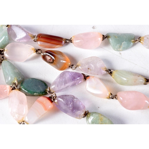 1038 - A LONG AGATE NECKLACE. 112 grams. 92 cm long.