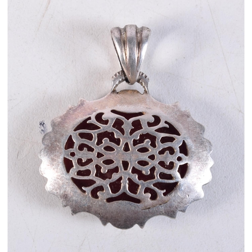 1052 - AN ANTIQUE MIDDLE EASTERN SILVER AND AGATE PENDANT. 18.7 grams. 4 cm x 3.5 cm.