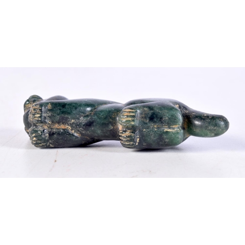 1061 - A MIDDLE EASTERN CARVED JADE BEAST. 9.25 cm x 3.5 cm.