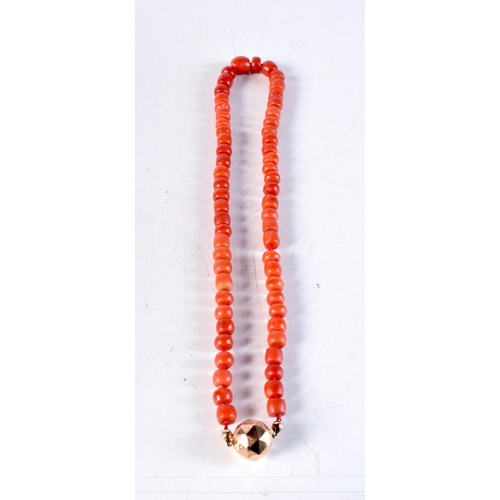 1068 - A VICTORIAN 15CT GOLD AND CORAL NECKLACE. 84.2 grams. 57 cm long.