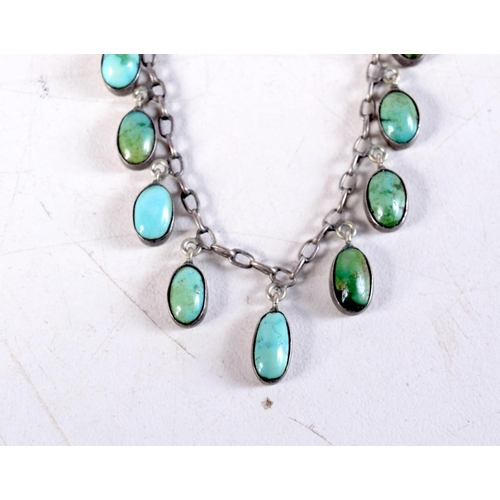 1097 - A SILVER AND TURQUOISE NECKLACE. 8.4 grams. 48 cm long.