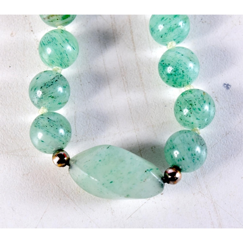 1098 - A CHINESE JADEITE NECKLACE. 72.4 grams. 82 cm long.