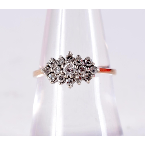 1116 - A 9CT GOLD AND DIAMOND CLUSTER RING. 2 grams. M.