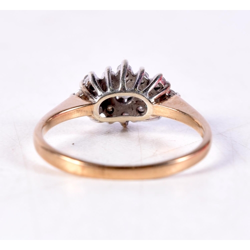 1116 - A 9CT GOLD AND DIAMOND CLUSTER RING. 2 grams. M.