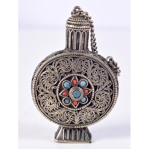 1118 - A TIBETAN SILVER CORAL AND TURQUOISE SCENT BOTTLE. 18.7 grams. 5.5 cm x 3.5 cm.