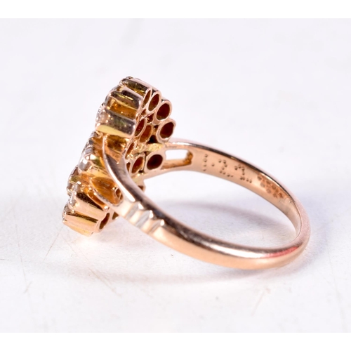 1141 - A GOLD AND DIAMOND CLUSTER RING. 5.3 grams. P.