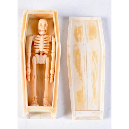 1145 - A CARVED BONE COFFIN. 11.5 cm x 4.25 cm.